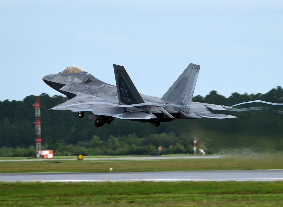 An F-22 Raptor from the 95th Fighter Squadron retracts its landing gear during takeoff at Tyndall Air Force Base, Fla., June 14, 2018. Tyndall conducted a Phase II deployment exercise where maintenance teams and their fighter aircraft were tested on their ability to project air dominance at a moment’s notice. (U.S. Air Force photo by Airman 1st Class Isaiah J. Soliz)