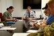 Staff Sgt. Jack Davis, center, 60th Air Mobility Wing Judge Advocate office, conducts a will execution June 25 at the base legal office at Travis Air Force Base, Calif. Davis and members of the 60th AMW JA office held a day to process wills and powers of attorney June 25, aiming to increase readiness by cutting into a backlog of requests for legal assistance. (U.S. Air Force photo/Nick DeCicco)