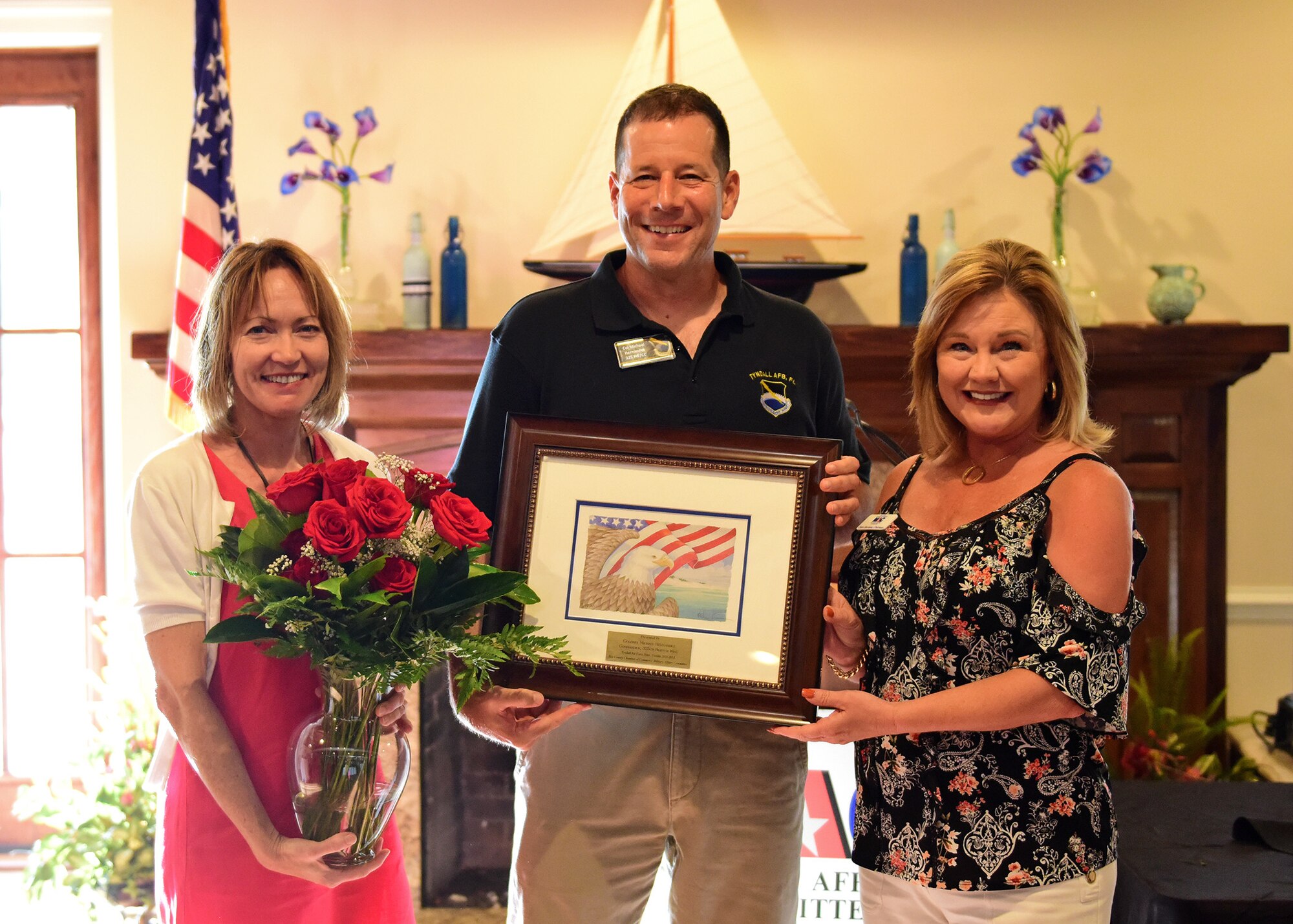 outgoing commander, his wife, and MAC chairman pose for group photo.