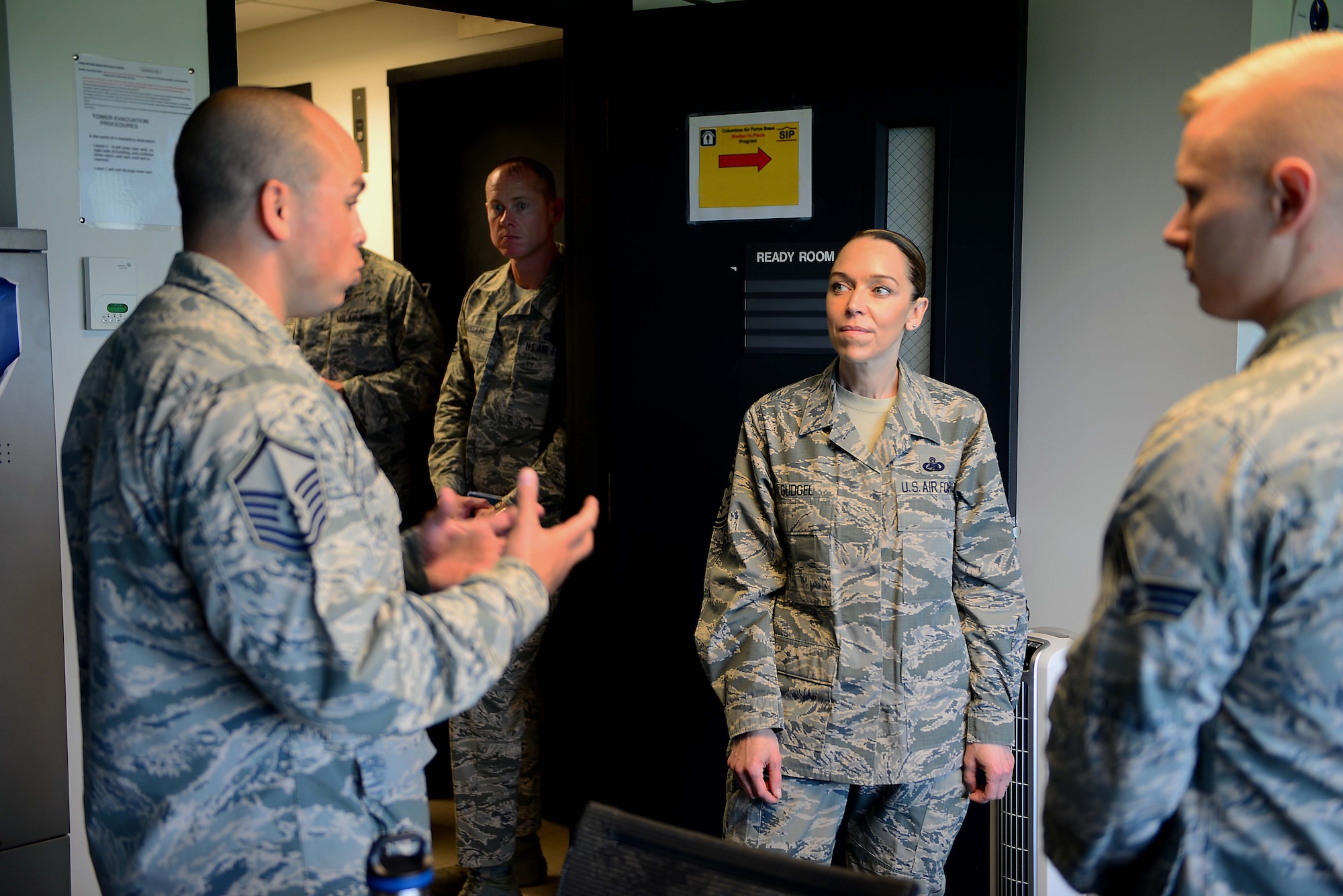 U.S. Air Force Master Sgt. Joshua Matias, 14th Operations Group tower chief air traffic controller speaks with Chief Master Sgt. Juliet Gudgel, command chief of Air Education and Training Command, at Columbus Air Force Base, Mississippi, June 21, 2018. During Gudgel’s tour of Columbus AFB, Matias spoke to her about the ATC tower and the operations conducted daily to produce pilots. (U.S Air Force photo by Airman 1st Class Beaux Hebert)