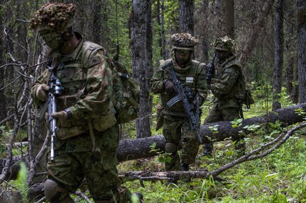 U.S. Army Alaska infantrymen from the 1st Stryker Brigade Combat Team, 25th Infantry Division, and Japan Ground Self-Defense Force soldiers from the 1st Airborne Brigade
execute platoon movement-to-contact and support-by-fire operations during Exercise Arctic Aurora at Joint Base Elmendorf-Richardson, Alaska, June 14, 2018. Arctic Aurora is an annual bilateral training exercise involving elements of U.S. Army Alaska and the JGSDF which focuses on strengthening ties between the two nations by executing combined small-unit airborne proficiency operations and basic small-arms marksmanship.
