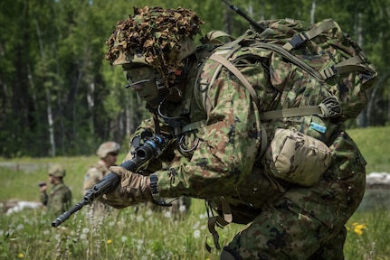 U.S. Army Alaska infantrymen from the 1st Stryker Brigade Combat Team, 25th Infantry Division, and Japan Ground Self-Defense Force soldiers from the 1st Airborne Brigade
execute platoon movement-to-contact and support-by-fire operations during Exercise Arctic Aurora at Joint Base Elmendorf-Richardson, Alaska, June 14, 2018. Arctic Aurora is an annual bilateral training exercise involving elements of U.S. Army Alaska and the JGSDF which focuses on strengthening ties between the two nations by executing combined small-unit airborne proficiency operations and basic small-arms marksmanship.