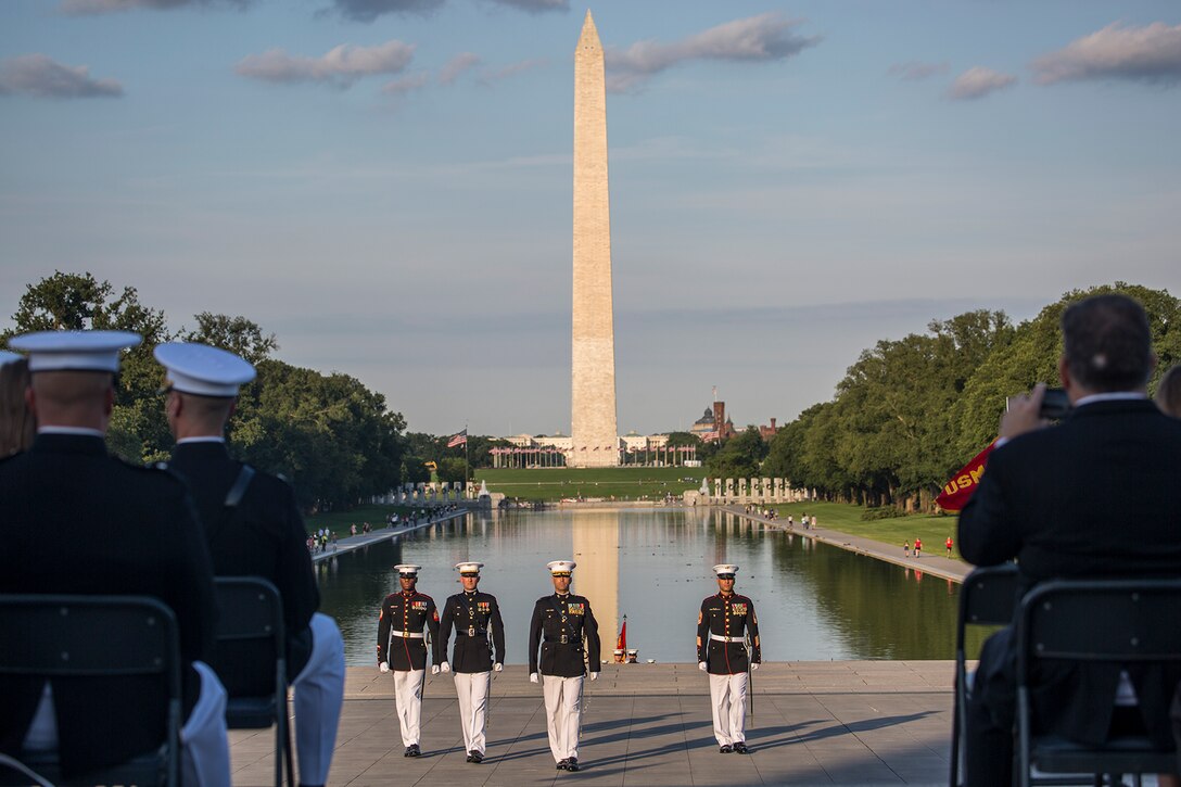 Marines with the Marine Barracks Washington D.C. parade marching staff march across the parade deck during a Tuesday Sunset Parade at the Lincoln Memorial, Washington D.C., June 26, 2018. The guest of honor for the parade was the Honorable William McClellan Thornberry, Texas’ 13th Congressional District Congressman, and the hosting official was Lt. Gen. Steven R. Rudder, deputy commandant, aviation, headquarters Marine Corps. (Official U.S. Marine Corps photo by Sgt. Robert Knapp/Released)
