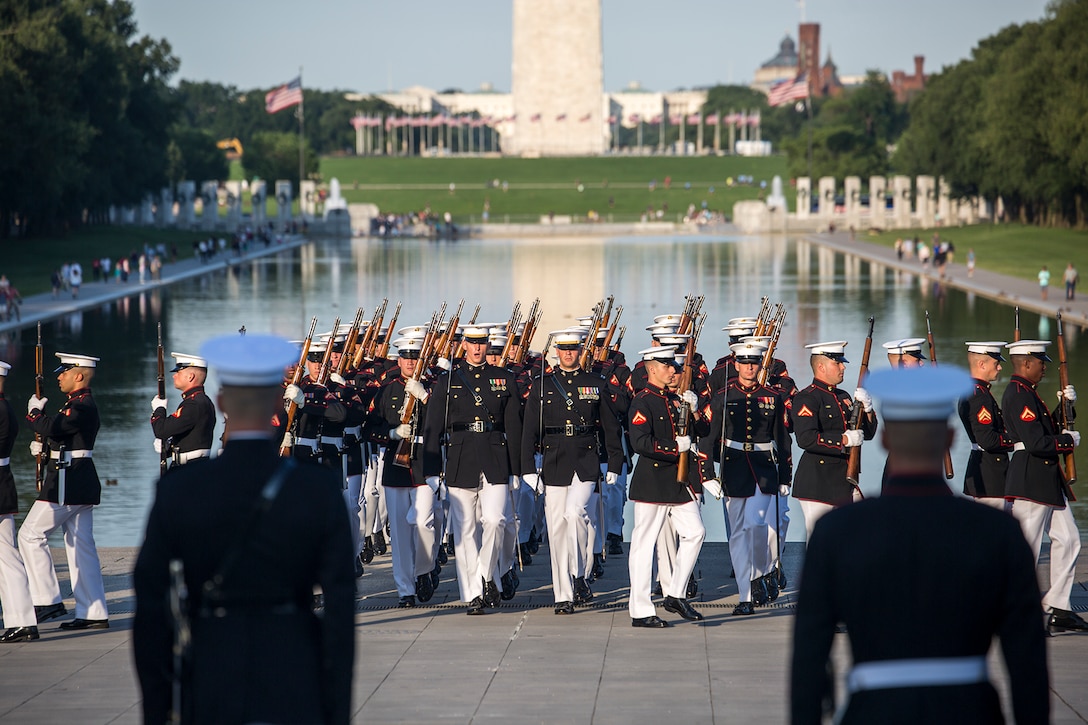 Marines with Alpha Company, Marine Barracks Washington D.C., march onto the parade deck during a Tuesday Sunset Parade at the Lincoln Memorial, Washington D.C., June 26, 2018. The guest of honor for the parade was the Honorable William McClellan Thornberry, Texas’ 13th Congressional District Congressman, and the hosting official was Lt. Gen. Steven R. Rudder, deputy commandant, aviation, headquarters Marine Corps. (Official U.S. Marine Corps photo by Sgt. Robert Knapp/Released)