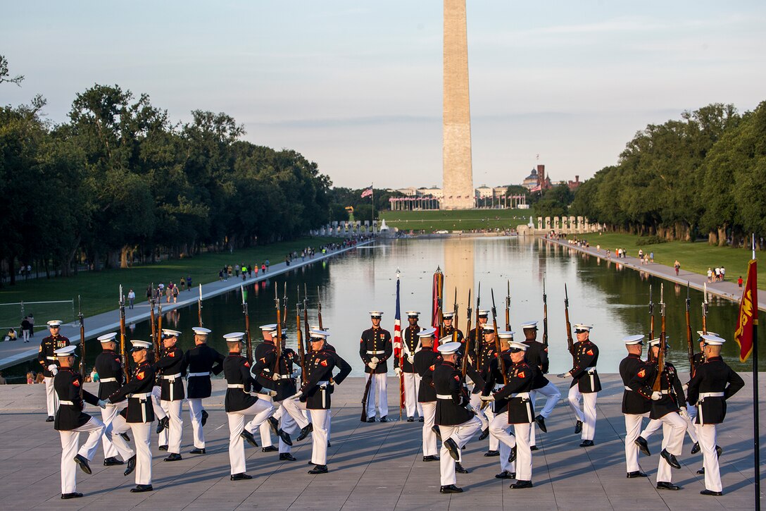 Marines with the U.S. Marine Corps Silent Drill Platoon perform precision rifle drill movements during a Tuesday Sunset Parade at the Lincoln Memorial, Washington D.C., June 26, 2018. The guest of honor for the parade was the Honorable William McClellan Thornberry, Texas’ 13th Congressional District Congressman, and the hosting official was Lt. Gen. Steven R. Rudder, deputy commandant, aviation, headquarters Marine Corps. (Official U.S. Marine Corps photo by Sgt. Robert Knapp/Released)