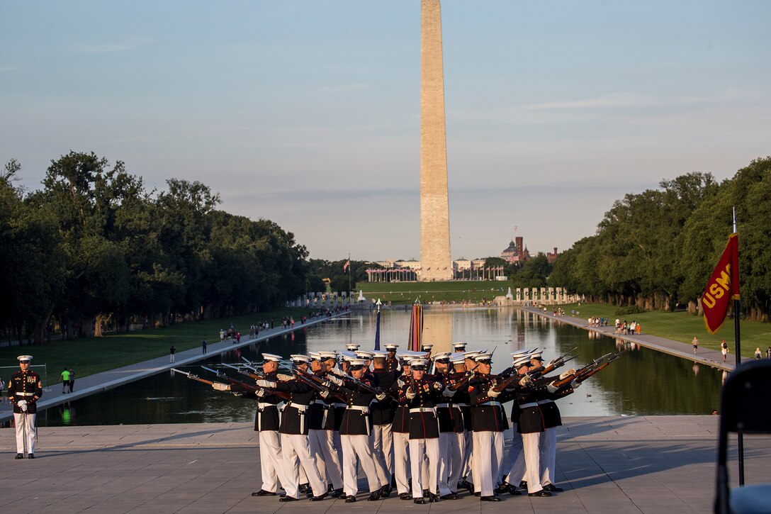 Marines with the U.S. Marine Corps Silent Drill Platoon execute their “bursting bomb” sequence during a Tuesday Sunset Parade at the Lincoln Memorial, Washington D.C., June 26, 2018. The guest of honor for the parade was the Honorable William McClellan Thornberry, Texas’ 13th Congressional District Congressman, and the hosting official was Lt. Gen. Steven R. Rudder, deputy commandant, aviation, headquarters Marine Corps. (Official U.S. Marine Corps photo by Sgt. Robert Knapp/Released)