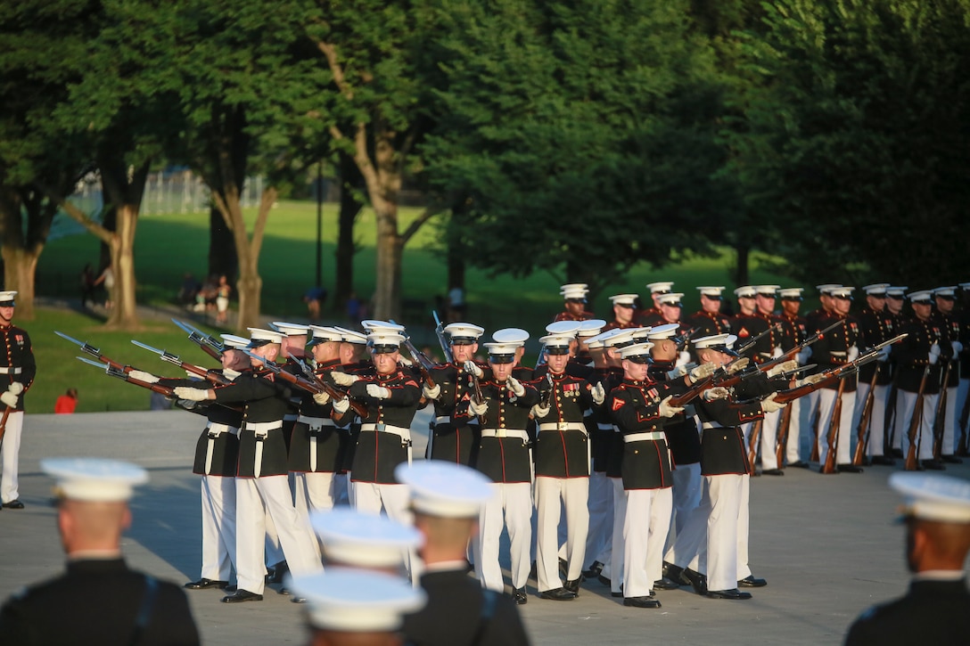 Marines with the U.S. Marine Corps Silent Drill Platoon execute their “bursting bomb” sequence during a Tuesday Sunset Parade at the Lincoln Memorial, Washington D.C., June 26, 2018. The guest of honor for the parade was the Honorable William McClellan Thornberry, Texas’ 13th Congressional District Congressman, and the hosting official was Lt. Gen. Steven R. Rudder, deputy commandant, aviation, headquarters Marine Corps. (Official U.S. Marine Corps photo by Cpl. Damon Mclean/Released)