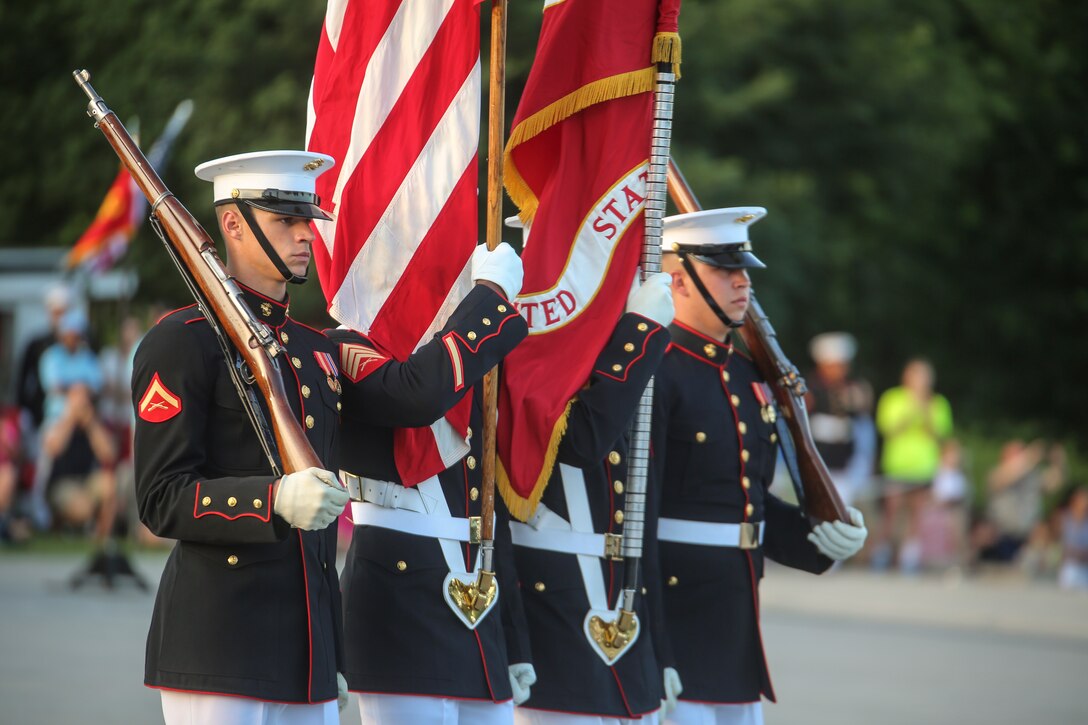Marines with the U.S. Marine Corps Color Guard march the National Ensign and the U.S. Marine Corps Battle Colors across the parade deck during a Tuesday Sunset Parade at the Lincoln Memorial, Washington D.C., June 26, 2018. The guest of honor for the parade was the Honorable William McClellan Thornberry, Texas’ 13th Congressional District Congressman, and the hosting official was Lt. Gen. Steven R. Rudder, deputy commandant, aviation, headquarters Marine Corps. (Official U.S. Marine Corps photo by Cpl. Damon Mclean/Released)