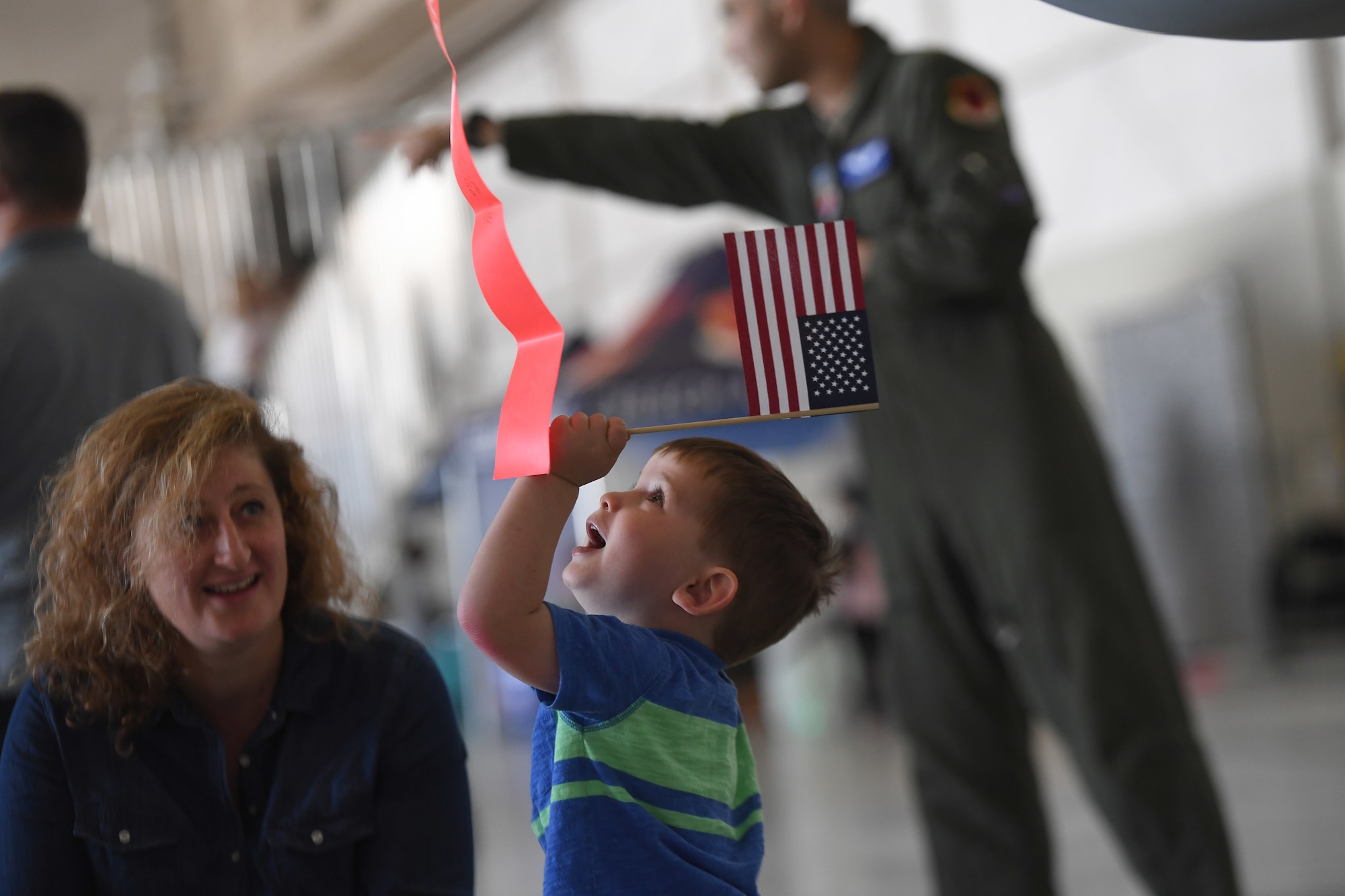 A child gazes at an MQ-1 Predator during bring your child to work day April 27, 2017, at Creech Air Force Base, Nev.