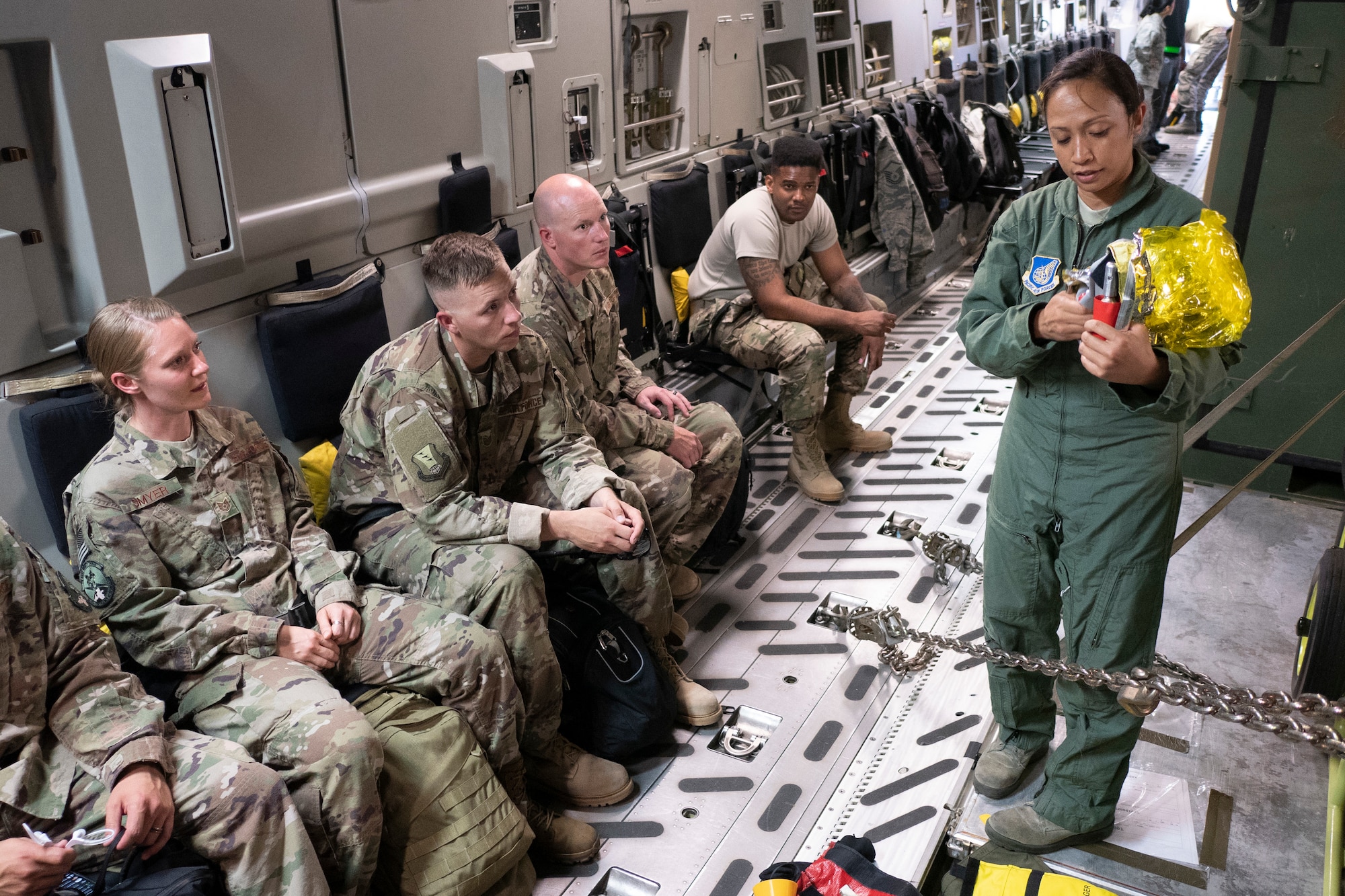 Tech. Sgt. Joleen Morse, 204th Airlift Squadron loadmaster, provides a safety briefing to members of the 435th Contingency Response Squadron on a C-17 Globemaster III in preparation for exercise Swift Response 18