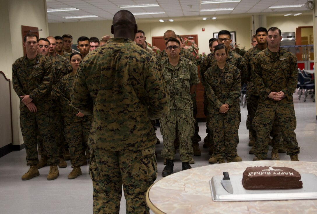 1st Sgt. Derrick Benbow, senior enlisted advisor of 3rd Law Enforcement Battalion, III Marine Headquarters Group, III Marine Expeditionary Force, addresses a formation of Marines and Corpsmen at Camp Mujuk, Pohang, Republic of Korea, June 17, 2017. Marines from Bravo Company, 3rd LE Bn, III MHG, III MEF and Corpsmen with 3rd Medical Battalion, 3rd Marine Logistics Group, III MEF came together to celebrate the birthday with a ceremonial cake cutting and birthday message reading from 3rd LE Bn senior enlisted advisor. (U.S. Marine Corps photo by Lance Cpl. Andy Martinez)