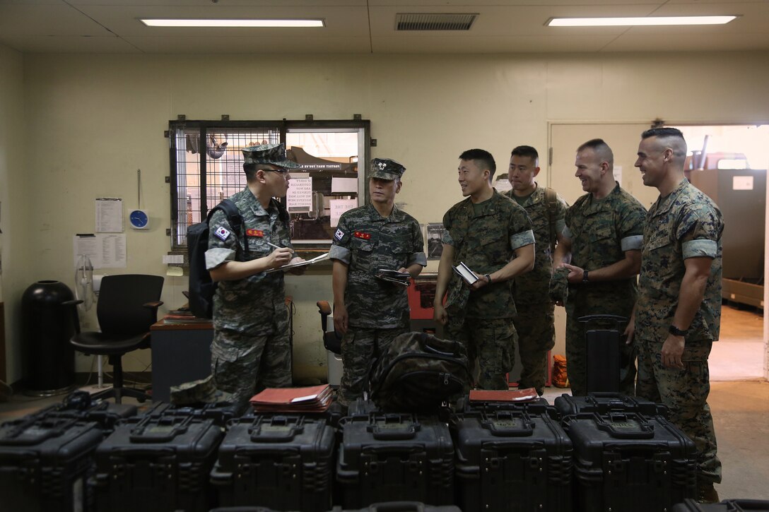 Official members of the Republic of Korea (ROK) Marine Logistics Group (MLG) visit the 3d Maintenance Battalion building aboard Camp Kinser, Okinawa, Japan, Nov. 1, 2017. The visit gives the two forces an opportunity to exchange information and ask questions in order to enhance interoperability between the two logistics groups.  The ROK MLG and U.S. Marine Corps' 3d MLG, III Marine Expeditionary Force share a long history of bilateral training and exchanges. (U.S. Marine Corps photo by Sgt. Kathy Nunez)