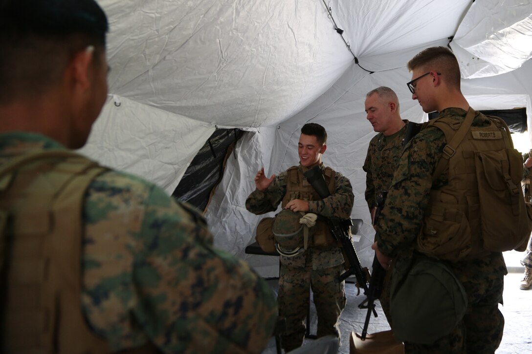 U.S. Marine Brig. Gen. Daniel B. Conley listens as a Marine explain the use of his equipment during the general’s visit of a combat service support area on Camp Hansen, Okinawa, Japan, during Exercise Blue Chromite 18, Nov. 3, 2017. The battle-tested capabilities ensure that the Navy-Marine Corps team is ready for any unpredictable threats in the Indo-Asia-Pacific region. Conley is the commanding general of 3d Marine Logistics Group, III Marine Expeditionary Force. The Marine is with Combat Logistics Battalion 4, Combat Logistics Regiment 3, 3d MLG, III MEF. (U.S. Marine Corps photo by Sgt. Kathy Nunez)