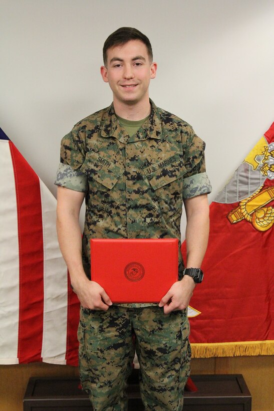 Cpl. Barry B. Smith, U.S. Marine Corps Forces Korea G6 help desk clerk, displays his Meritorious Mast received for superior performance while serving as a cyber network operator, June 26. The Sacramento, Calif., native played a critical role in the transportation and installation of unclassified and classified computer networks as well as assets during MARFORK’s move from Yongsan Army Garrison in Seoul to Camp Humphreys. (Official U.S. Marine Corps photo by Staff Sgt. Anthony Kirby/Released)