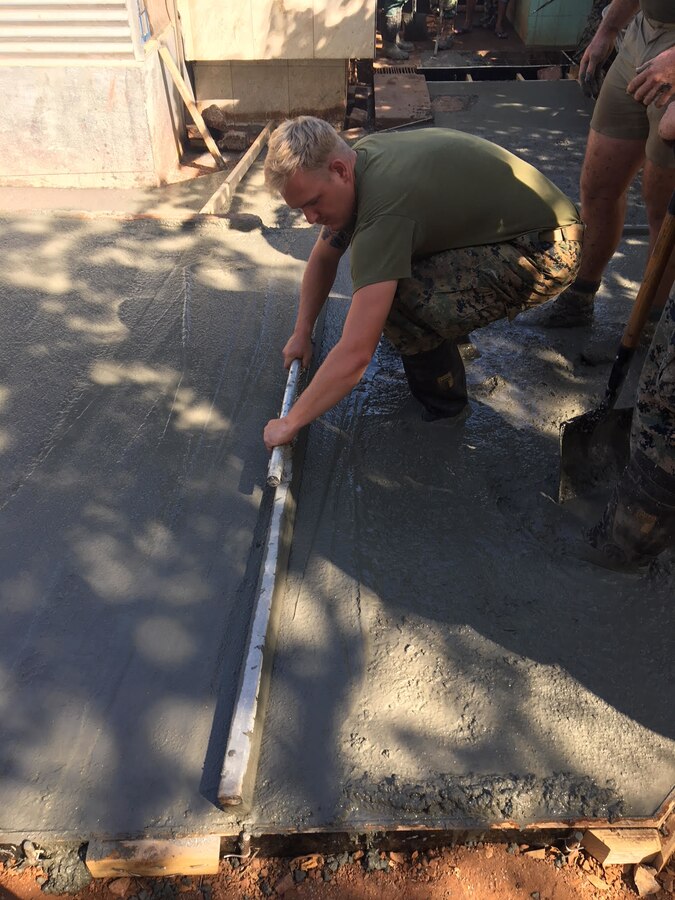 U.S. Marine Cpl. Tyler J. Roath screeds a concrete pad for a kitchen for the Timorese during Harii Hamutuk 17 (HH17) at Metinaro Military Base, Timor-Leste, Oct. 21, 2017. HH17 allows the Marines to build personal, enduring relationships with Timor-Leste. Roath is with 9th Engineer Support Battalion, 3d Marine Logistics Group, III Marine Expeditionary Force. (U.S. Marine Corps Courtesy Photo)