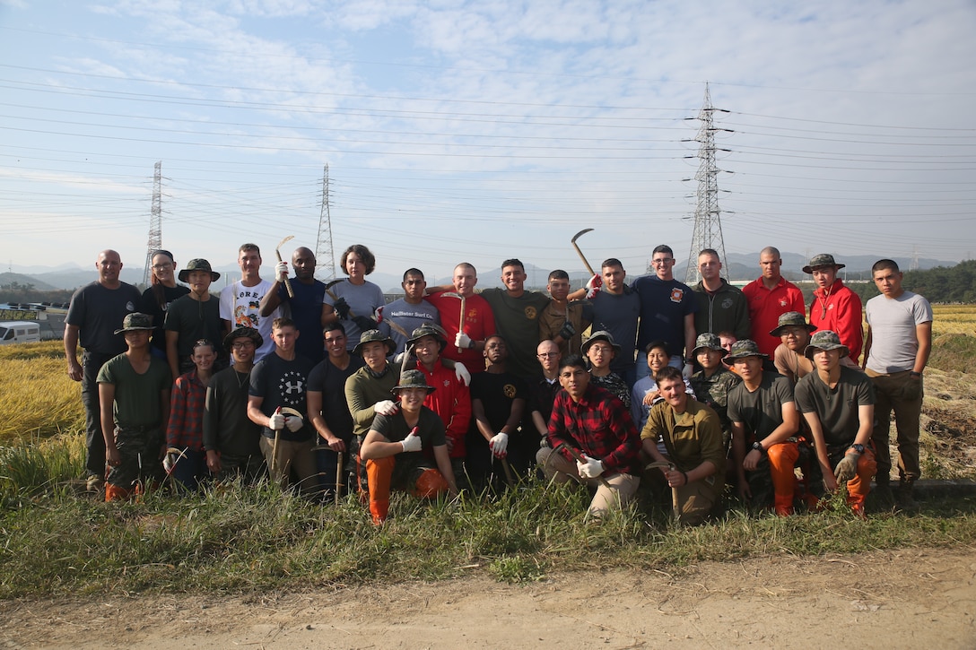 Republic of Korea Marines with the ROK Marine Logistics Group and U.S. Marines with Combat Logistics Regiment 3, 3d MLG, gather together before harvesting rice, Oct. 27, 2017 in Pohang, South Korea. The ROK Marines and U.S. Marines helped local rice farmers harvest crops from fields damaged by Super Typhoon Lan during Exercise Winter Workhorse 17/ Korea Marine Exchange Program 18.1. The individual Marines and Sailors’ relationships with their ROK counterparts is the strength of III MEF in the Pacific. (U.S. Marine Corps photo by Sgt. Tiffany Edwards)