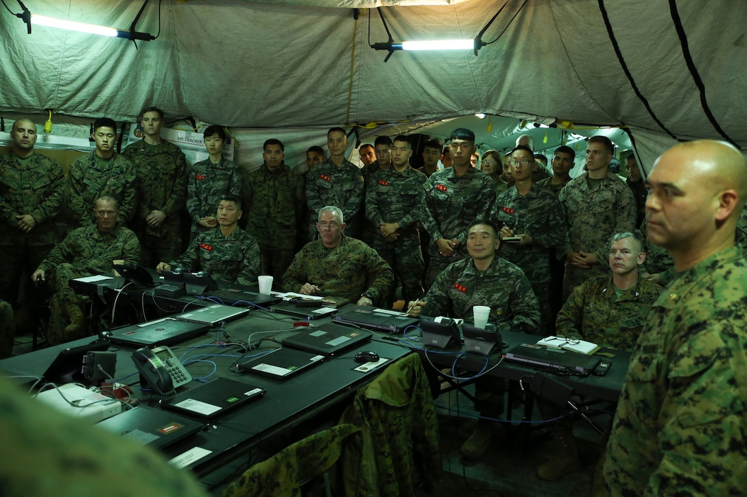 Republic of Korea Marine Corps leadership from the ROK MLG and U.S. Marine Corps leadership from 3d Marine Logistics Group receive a commander’s update brief during a notional exercise Oct. 19, 2017. ROK and U.S. Marines participated in bilateral logistics training during Exercise Winter Workhorse 17/Korean Marine Exchange Program 18.1. III MEF Marines and Sailors gain valuable operational experience through working with our professional, warfighting ROK allies.  Our combined development is an equal, two-way exchange. (U.S Marine Corps photo by Sgt. Tiffany Edwards)