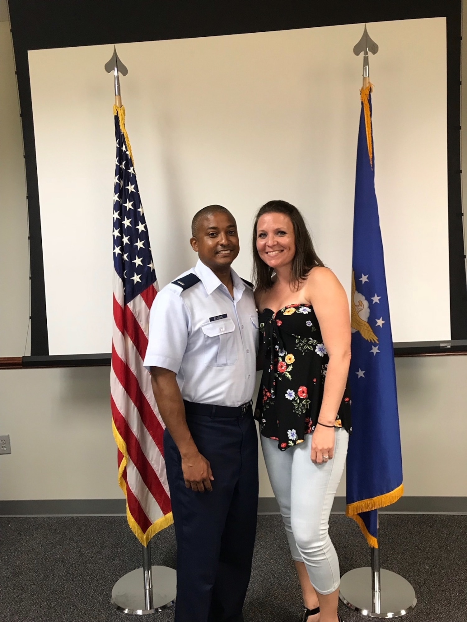 1st Lieutenant Kenneth Ellison poses for a picture with his wife, Melissa Ellison, in the Commissioned Officer Training Class 18-04 classroom. Ellison commissioned after 14 years of enlisted service and continues his family’s legacy of continuous Air Force service since his grandfather enlisted in 1947.