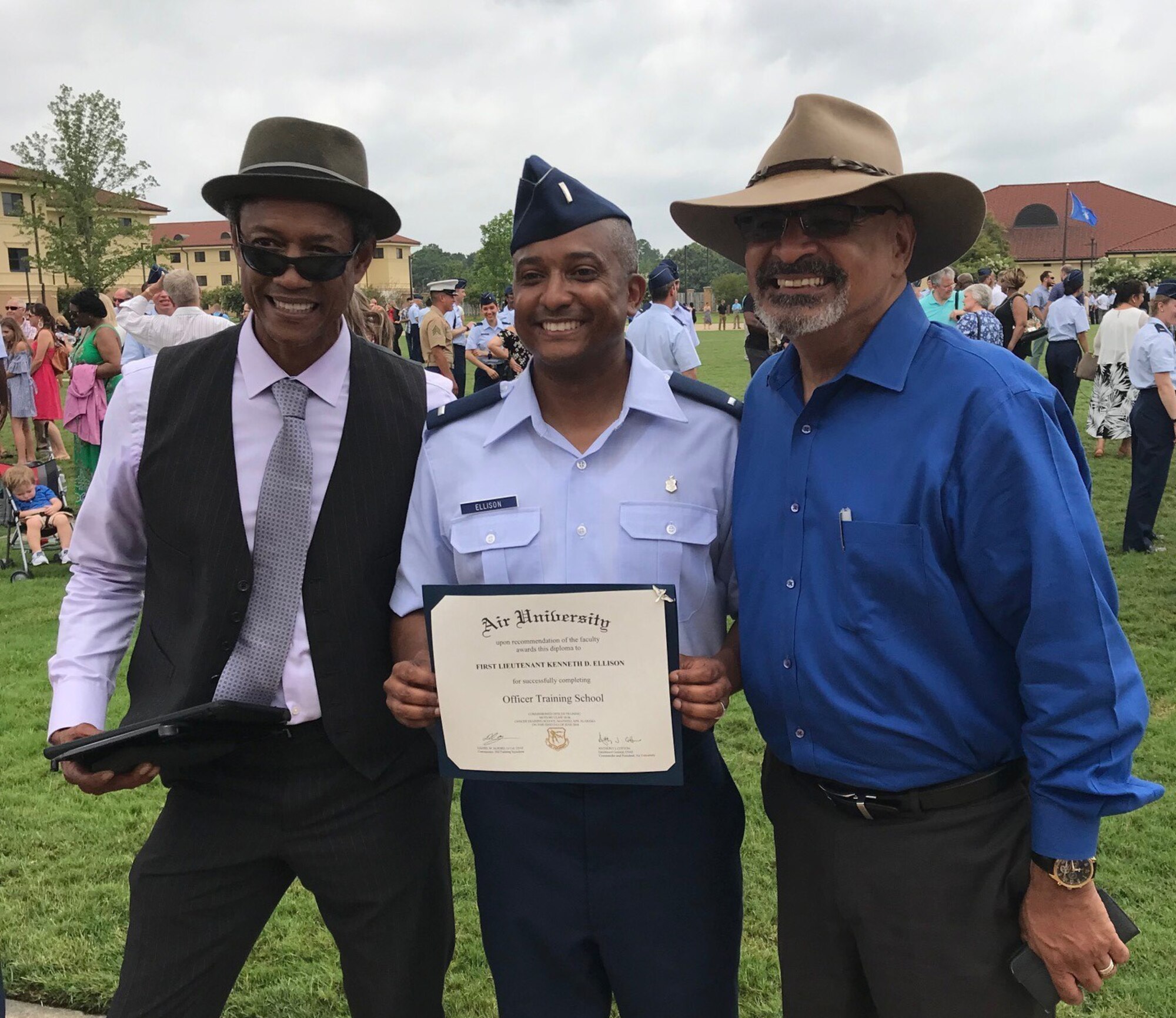 1st Lieutenant Kenneth Ellison poses for a picture with his father, retired Master Sgt. Tony Ellison, and his uncle, retired Chief Master Sgt. Rodney Ellison after the  the Commissioned Officer Training Class 18-04 Graduation Parade. Ellison commissioned after 14 years of enlisted service and continues his family’s legacy of continuous Air Force service since his grandfather enlisted in 1947.