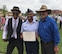 1st Lieutenant Kenneth Ellison poses for a picture with his father, retired Master Sgt. Tony Ellison, and his uncle, retired Chief Master Sgt. Rodney Ellison after the  the Commissioned Officer Training Class 18-04 Graduation Parade. Ellison commissioned after 14 years of enlisted service and continues his family’s legacy of continuous Air Force service since his grandfather enlisted in 1947.