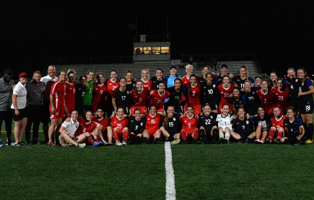 True sportsmanship as Canada and USA share the field afterwards in friendship.  Elite military soccer players from around the world compete for dominance at Fort Bliss’ Stout Field June 22 - July 3, 2018 to determine the best of the best at the 2018 Conseil International du Sport Militaire (CISM) World Military Women’s Football Championship. International military teams squared off to eventually crown the best women soccer players among the international militaries participating. U.S. Navy photo by