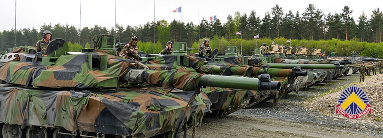 Tanks from six NATO and nations wait for their turn to fire at targets during the Strong Europe Tank Challenge (SETC), at the 7th Army Training Command's Grafenwoehr Training Area, Germany, May 12, 2017. The Strong Europe Tank Challenge (SETC) is co-hosted by U.S. Army Europe and the German Army, May 7-12, 2017. The competition is designed to project a dynamic presence, foster military partnership, promote interoperability, and provides an environment for sharing tactics, techniques and procedures. Platoons from six NATO and partner nations are in the competition. (U.S. Army photo by Spc. Javon Spence)