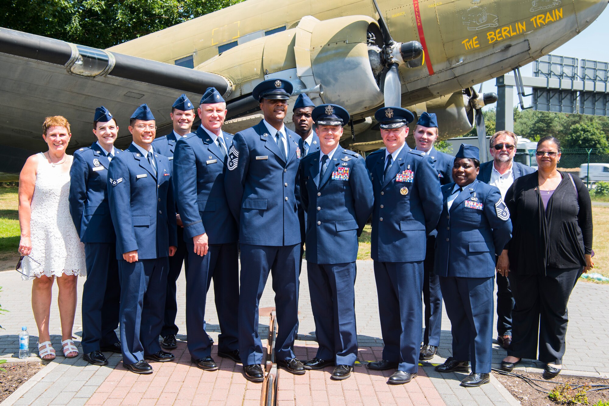 Denise Halvorsen-Williams, left, and Marilyn Halvorsen-Sorenson, daughters of Ret. Col. Gail S. Halvorsen, known as the Candy Bomber, speak with U.S. Air Force Col. Tad D. Clark, 52nd Fighter Wing vice commander, and U.S. Air Force Lt. Col. Shannon Caleb, commander of the 726th Air Mobility Squadron, both from Spangdahlem Air Base, at the Berlin Airlift 70th anniversary commemoration at Frankfurt International Airport, Germany, June 26, 2018. The Candy Bomber played a major role during the historic event by dropping 23 tons of candy to children. (U.S. Air Force photo by Airman 1st Class Valerie Seelye)