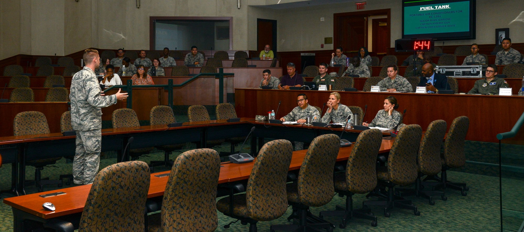 U.S. Air Force Maj. Ryan Garlow, 6th Air Mobility Wing (AMW), presents an idea for a portable air conditioner for the KC-135 Stratotanker aircraft to 6th AMW leadership during Fuel Tank at MacDill Air Force Base, Fla., June 27, 2018.