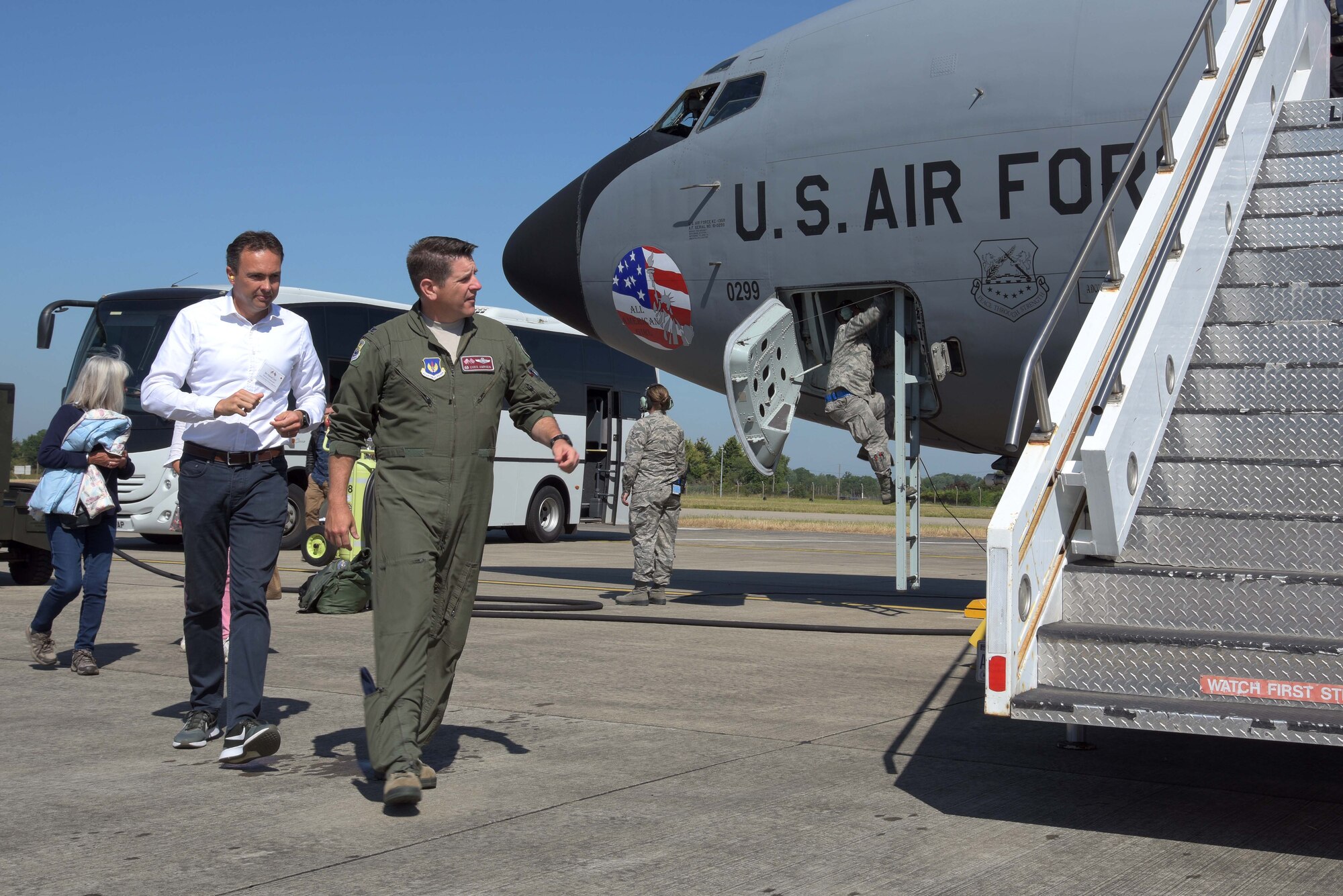 U.S. Air Force Col. Christopher Amrhein, 100th Air Refueling Wing commander, leads a group of honorary commanders onto a U.S. Air Force KC-135 Stratotanker during Honorary Commanders Day at RAF Mildenhall, England, June 26, 2018. Honorary Commanders Day is an event that provides an opportunity to foster relations between the base and the local community. (U.S. Air Force photo by Airman 1st Class Benjamin Cooper)