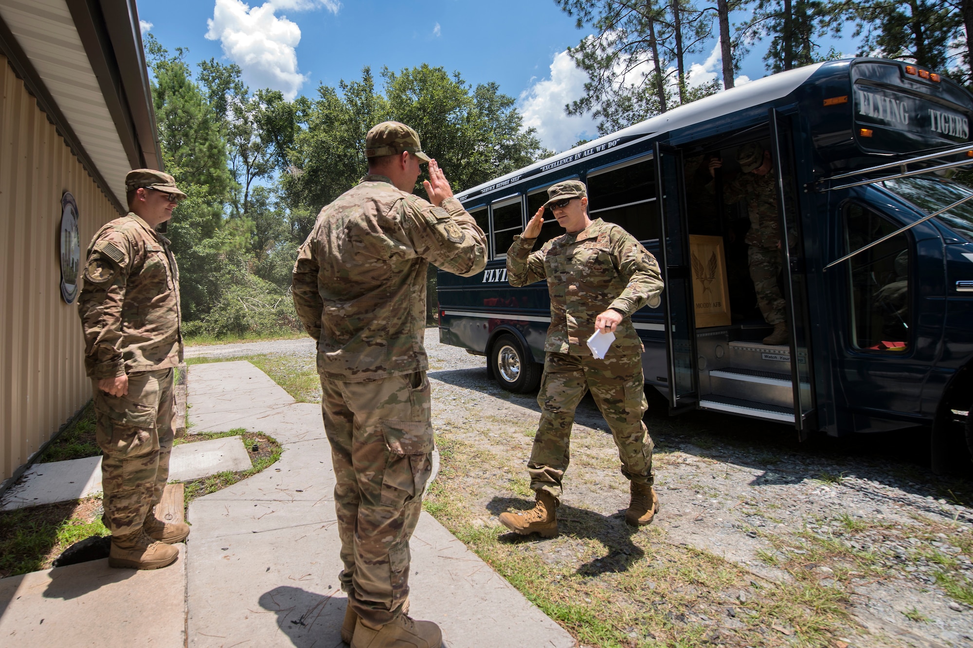 An Airman from the 820th Base Defense Group (BDG), left, salutes Col. Paul Birch, 93d Air Ground Operations Wing (AGOW) commander, right, during an immersion tour, June 25, 2018, at Moody Air Force Base, Ga. Birch toured the BDG to gain a better understanding of their overall mission, duties and comprehensive capabilities. Prior to taking command of the 93d AGOW, Birch was the commander of the 380th Expeditionary Operations Group at Al Dhafra Air Base, United Arab Emirates. (U.S. Air Force photo by Airman 1st Class Eugene Oliver)