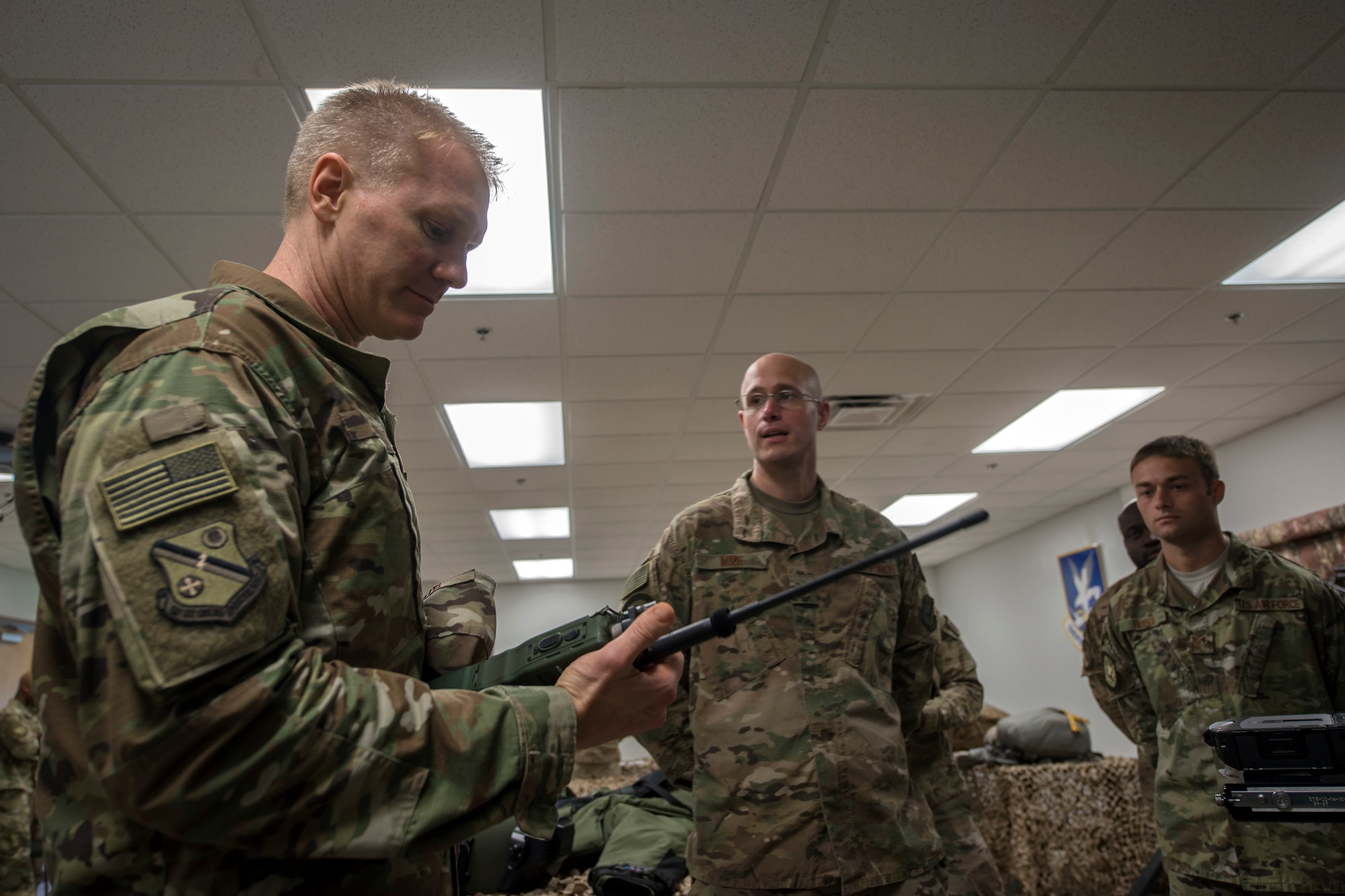 Col. Paul Birch, 93d Air Ground Operations Wing (AGOW) commander, inspects a radio communication device during an immersion tour, June 25, 2018, at Moody Air Force Base, Ga. Birch toured the 820th Base Defense Group to gain a better understanding of their overall mission, duties and comprehensive capabilities. Prior to taking command of the 93d AGOW, Birch was the commander of the 380th Expeditionary Operations Group at Al Dhafra Air Base, United Arab Emirates. (U.S. Air Force photo by Airman 1st Class Eugene Oliver)