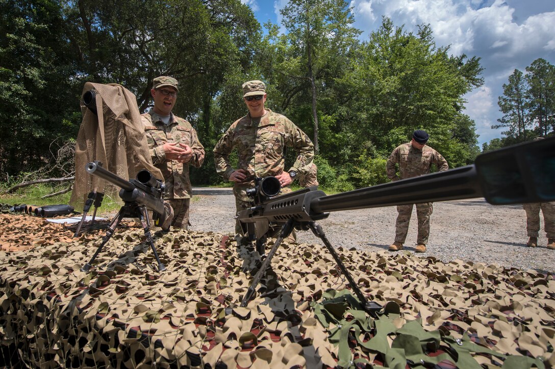 Col. Paul Birch, 93d Air Ground Operations Wing (AGOW) commander, examines a M107 .50-caliber Special Applications Scoped Rifle during an immersion tour, June 25, 2018, at Moody Air Force Base, Ga.  Birch toured the 820th Base Defense Group to gain a better understanding of their overall mission, duties and comprehensive capabilities. Prior to taking command of the 93d AGOW, Birch was the commander of the 380th Expeditionary Operations Group at Al Dhafra Air Base, United Arab Emirates. (U.S. Air Force photo by Airman 1st Class Eugene Oliver)