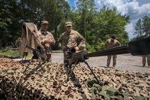 Col. Paul Birch, 93d Air Ground Operations Wing (AGOW) commander, examines a M107 .50-caliber Special Applications Scoped Rifle during an immersion tour, June 25, 2018, at Moody Air Force Base, Ga.  Birch toured the 820th Base Defense Group to gain a better understanding of their overall mission, duties and comprehensive capabilities. Prior to taking command of the 93d AGOW, Birch was the commander of the 380th Expeditionary Operations Group at Al Dhafra Air Base, United Arab Emirates. (U.S. Air Force photo by Airman 1st Class Eugene Oliver)