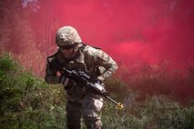 An Airman from the 820th Base Defense Group (BDG), runs to cover during an Area Security Operations demonstration, June 25, 2018, at Moody Air Force Base, Ga. Col. Paul Birch, 93d Air Ground Operations Wing (AGOW) commander, toured the BDG to gain a better understanding of their overall mission, duties and comprehensive capabilities. Prior to taking command of the 93d AGOW, Birch was the commander of the 380th Expeditionary Operations Group at Al Dhafra Air Base, United Arab Emirates. (U.S. Air Force photo by Airman 1st Class Eugene Oliver)