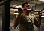 U.S. Air Force Airman Basic Cole Kramn, a Survival, Evasion, Resistance and Escape Specialist Training Orientation Course candidate, conducts a pull-up during a mock physical fitness assessment at the SERE specialist schoolhouse at Joint Base San Antonio-Lackland March 22. Kramn, a Spokane, Washington, native, is one of about 400 candidates to come through the orientation course annually.