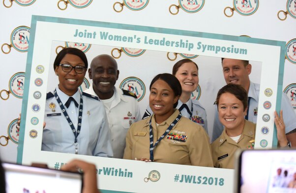 Service members pose for a photo at the 2018 Joint Women's Leadership Symposium June 21, 2018, in San Diego. The symposium included attendees from the U.S. Air Force, Army, Navy, Marine Corps, and Coast Guard and 20 other countries. (U.S. Air Force photo by 1st Lt. Annabel Monroe)