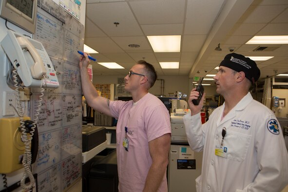 Col. Joseph DuBose, trauma surgeon and Center for the Sustainment of Trauma and Readiness Skills (C-STARS) Baltimore director, and Master Sgt. Shane Patterson, a respiratory therapist and C-STARS Baltimore superintendent, receive a report on an incoming patient at the Trauma Resuscitation Unit at the University of Maryland Medical Center, Baltimore, June 13, 2018. The Air Force’s C-STARS Baltimore program partners with the R Cowley Shock Trauma Center at the University of Maryland Medical Center to ensure medical Airmen train on the latest trauma care techniques. These techniques prepare medical Airmen to treat trauma patients in a deployed setting. (Courtesy photo)