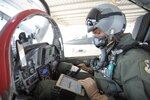 Tony Ervin, 502nd Air Base Wing, Public Affairs illustrator, prepares to test the electronic flight bag during flight, June 21, at Joint Base San Antonio-Randolph.  EFBs are used by aircrews to plan, execute and debrief flights. Applications on the tablets enable pilots and their crews to determine weather patterns, approach paths, flight line makeup and other relevant information used during all types of flying missions.  (U.S. Air Force photo by Joel Martinez)