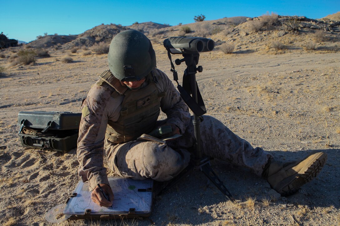 Cpl. Jan Eric Schaeuble, a rifleman and forward observer with Fox Company, 4th Light Armored Reconnaissance Battalion, 4th Marine Division, uses a vector kit to determine range and direction to a target and plots it on his map during the Air Assault Course at Integrated Training Exercise 4-18 at Marine Corps Air Ground Combat Center Twentynine Palms, California, on June 22, 2018. Integrated Training Exercise is a capstone exercise that enables Marines to maintain the highest levels of proficiency and readiness for worldwide deployment and the ability to work as a MAGTF. (United States Marine Corps photo by Cpl. Alexis B. Rocha/released)