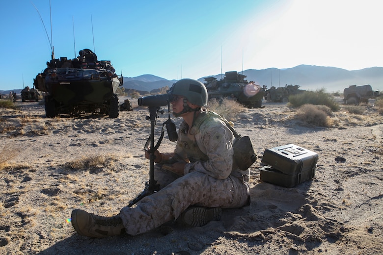 Cpl. Jan Eric Schaeuble, a rifleman and forward observer with Fox Company, 4th Light Armored Reconnaissance Battalion, 4th Marine Division, uses a vector kit to determine range and direction to a target and plots it on his map during the Air Assault Course at Integrated Training Exercise 4-18 at Marine Corps Air Ground Combat Center Twentynine Palms, California, on June 22, 2018. Integrated Training Exercise is a capstone exercise that enables Marines to maintain the highest levels of proficiency and readiness for worldwide deployment and the ability to work as a MAGTF. (United States Marine Corps photo by Cpl. Alexis B. Rocha/released)