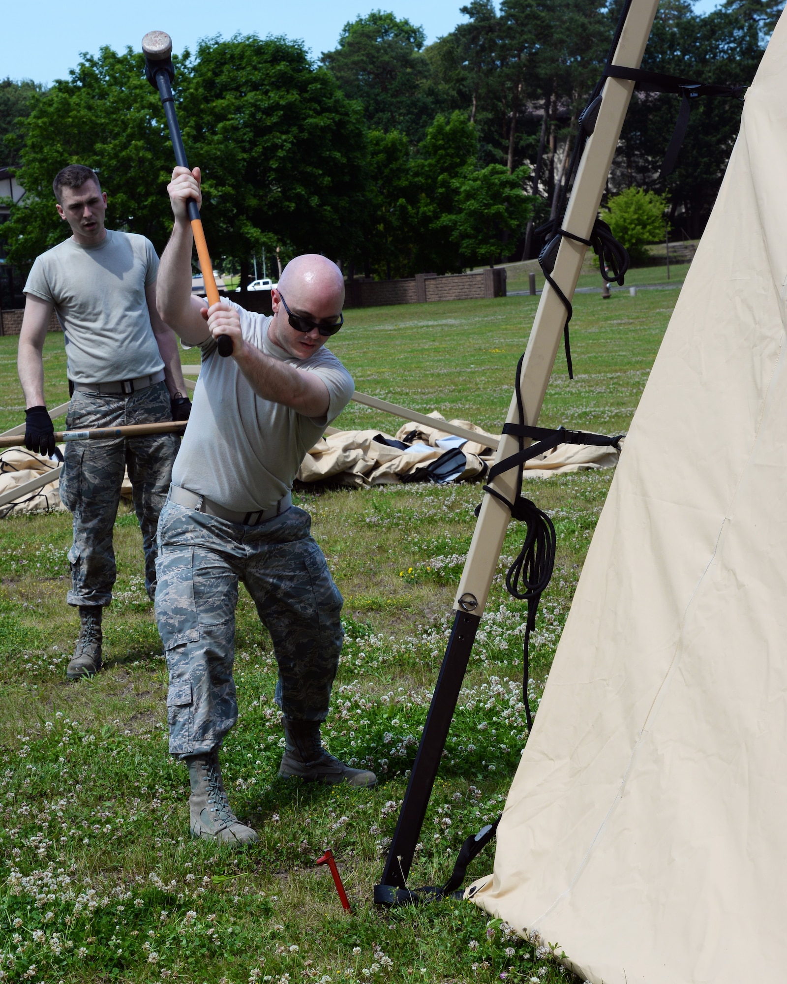 Airmen from the 86th Medical Group and the 86th Logistics Squadron set up an Expeditionary Medical Support System modular field hospital during en route patient staging training during Exercise Maroon Surge on Ramstein Air Base, Germany, June 4, 2018. EMEDS have a scalable design that allows the Air Force to deploy them in configurations that support small teams supporting a limited number of casualties, to large medical systems offering specialized care. (U.S. Air Force photo by Airman 1st Class Ariel Leighty)