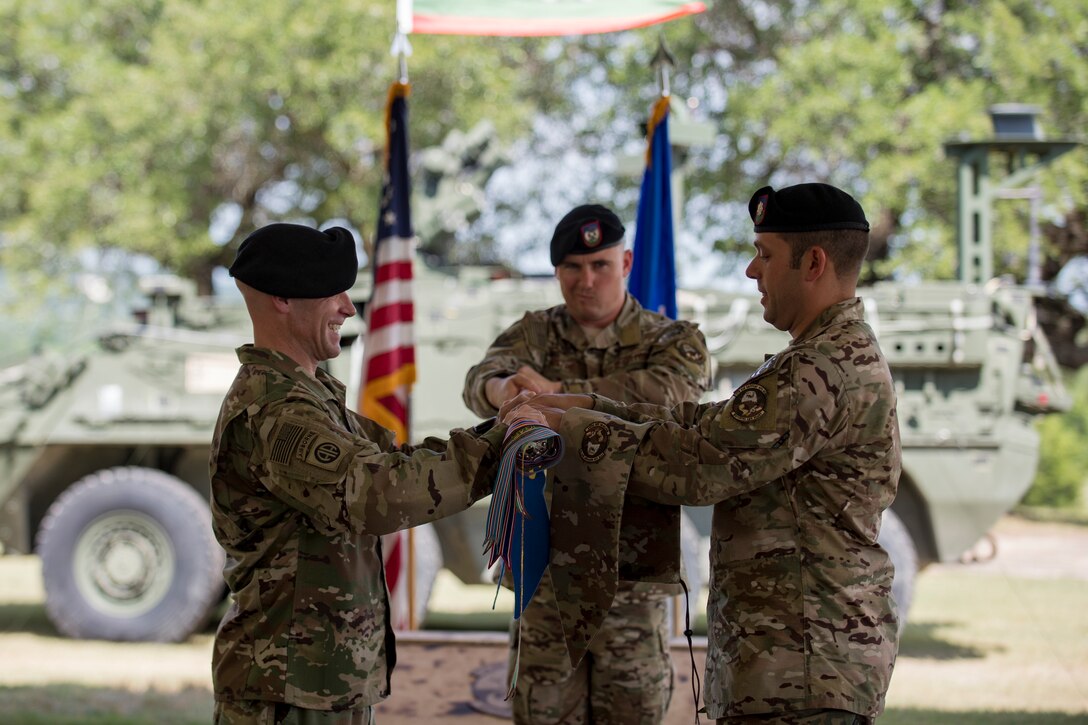 Col. Aaron Ullman, left, 3rd Air Support Operations Group commander, and Lt. Col. Frank Biancardi, outgoing 11th Air Support Operations Squadron (ASOS) commander, unfurl a guidon during a squadron inactivation ceremony, June 21, 2018, at Fort Hood, Texas. As a part of the 93d Air Ground Operations Wing from Moody Air Force Base, Ga., the 11th ASOS ‘Steel Eagles’ mission will remain unchanged as they continue to support Ft. Hood and absorb into the 9th ASOS. The enhanced 9th ASOS will continue to provide tactical air support to align with any U.S. Army unit that needs air support for their scheme of maneuver. (U.S. Air Force photo by Senior Airman Daniel Snider)