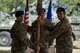 Lt. Col. Frank Biancardi, outgoing 11th Air Support Operations Squadron (ASOS) commander, passes the guidon to Col. Aaron Ullman, left, 3rd Air Support Operations Group commander during a squadron inactivation ceremony, June 21, 2018, at Fort Hood, Texas. As a part of the 93d Air Ground Operations Wing from Moody Air Force Base, Ga., the 11th ASOS ‘Steel Eagles’ mission will remain unchanged as they continue to support Ft. Hood and absorb into the 9th ASOS. The enhanced 9th ASOS will continue to provide tactical air support to align with any U.S. Army unit that needs air support for their scheme of maneuver. (U.S. Air Force photo by Senior Airman Daniel Snider)