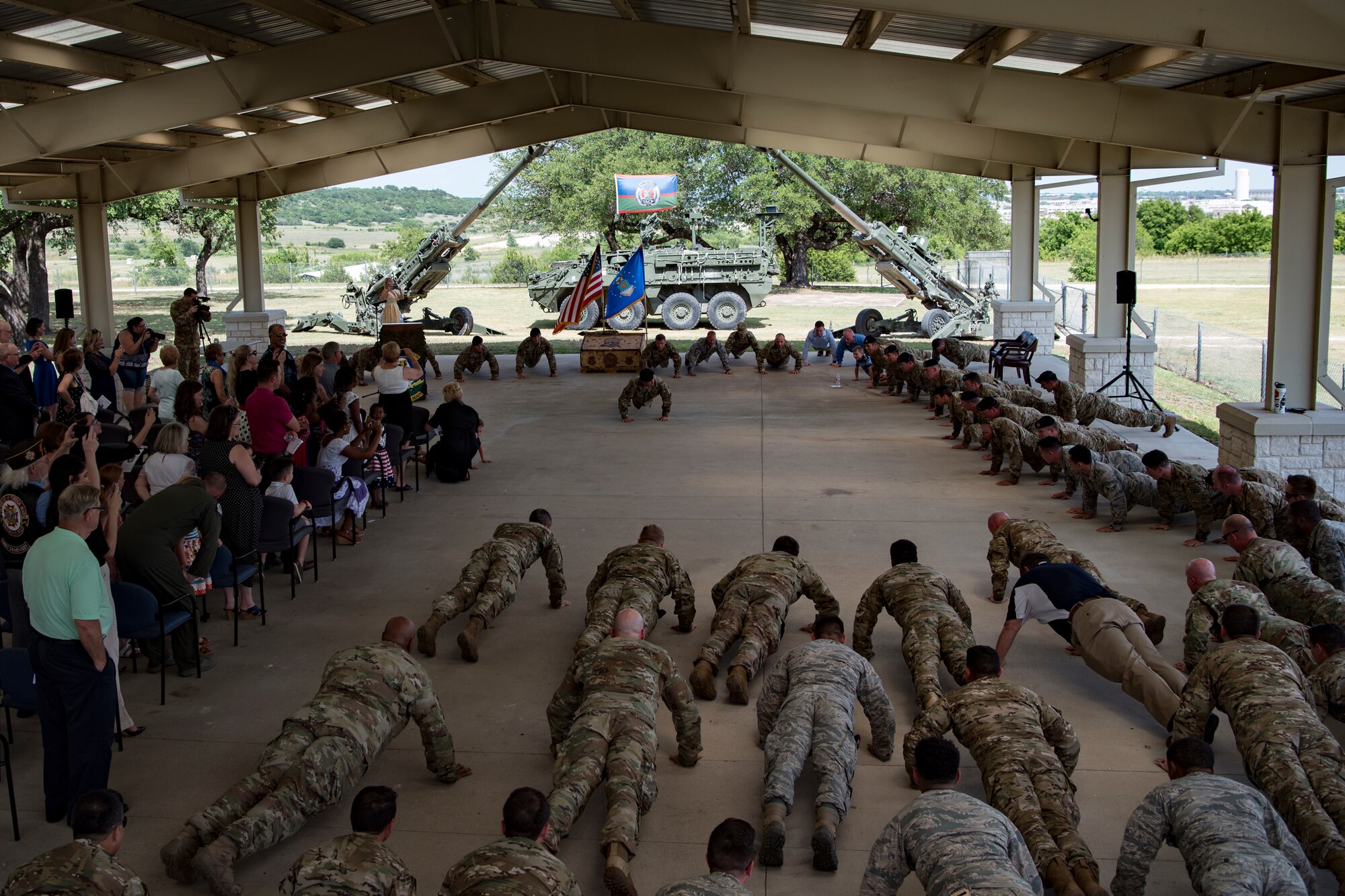 Past and present members of the 11th Air Support Operations Squadron perform memorial pushups during a squadron inactivation ceremony, June 21, 2018, at Fort Hood, Texas. As a part of the 93d Air Ground Operations Wing from Moody Air Force Base, Ga., the 11th ASOS ‘Steel Eagles’ mission will remain unchanged as they continue to support Ft. Hood and absorb into the 9th ASOS. The enhanced 9th ASOS will continue to provide tactical air support to align with any U.S. Army unit that needs air support for their scheme of maneuver. (U.S. Air Force photo by Senior Airman Daniel Snider)