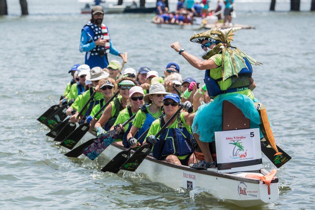 Dragonboat at the Beach rowing team cheers as they return from one of their racing heats during the annual DragonBoat Beaufort charity race June 23 at Waterfront Park in downtown Beaufort. Both local and traveling teams competed in the volunteer organized event that strives to create a strong sense of wellness through competition, camaraderie and also raises money for local cancer patients, survivors, and families.