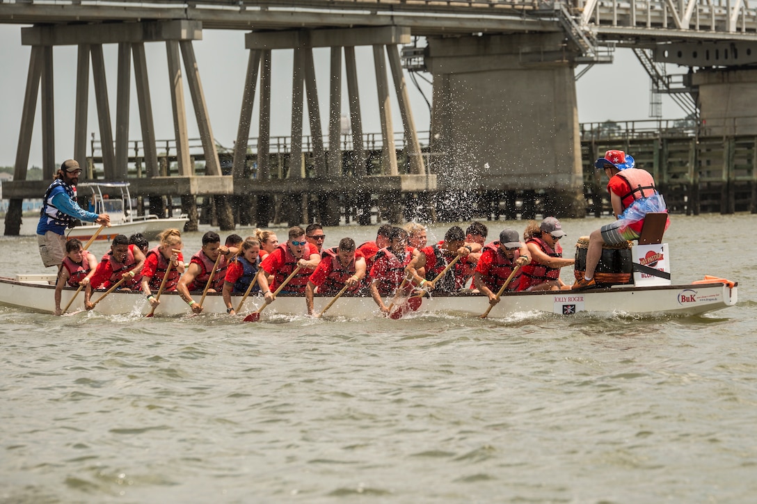The Single Marine Program rowing team competes during the 6th annual DragonBoat Beaufort charity race June 23 at Waterfront Park in downtown Beaufort. The team was comprised of Marines and Sailors from the Tri-command. This was the second year SMP put together a team for the event. Both local and traveling teams competed in the volunteer organized event that strives to create a strong sense of wellness through competition, camaraderie and also raises money for local cancer patients, survivors, and families. The SMP team received the fastest local time for the second year in a row.