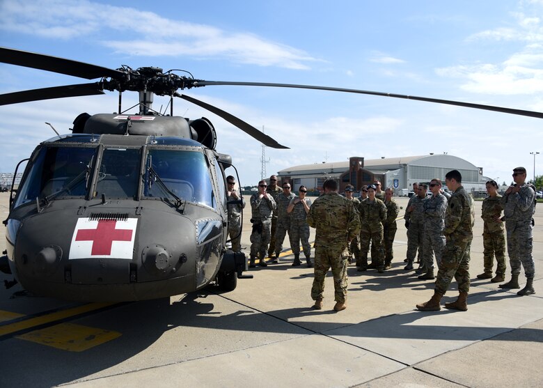 Members of the Pittsburgh International Airport Air Reserve Station Aeromedical Staging Squadron and Aeromedical Evacuation Squadron receive training on how to load a patient onto a helicopter at the Pittsburgh International Airport Air Reserve Station June 26, 2018. This was part of their joint training and was something these medical squadrons do not get to do often.(U.S. Air Force Photo by Senior Airman Grace Thomson)