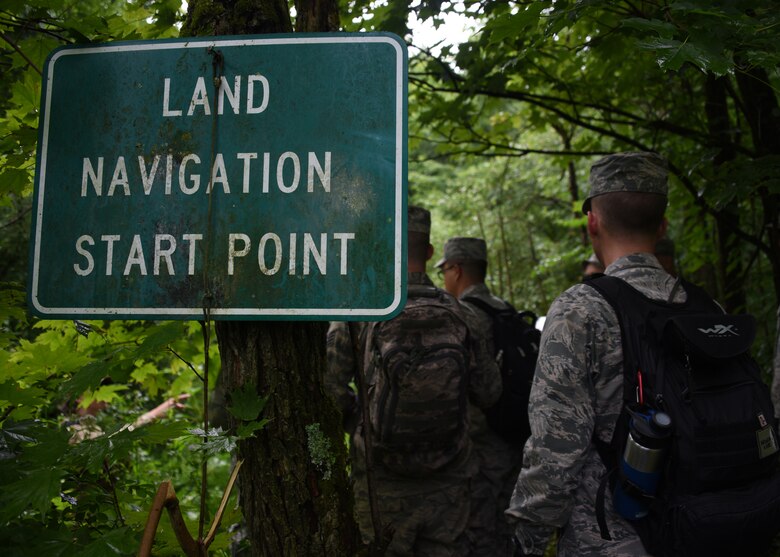 Airmen from the Aeromedical Staging Squadron and the Aeromedical Evacuation Squadron at the Pittsburgh International Airport Air Reserve Station, begin the land navigation exercise at Camp Dawson, West Virginia June 21, 2018. The team had planned their route in class and used the tools from the class to choose the direction to go in. (U.S. Air Force Photo by Senior Airman Grace Thomson)