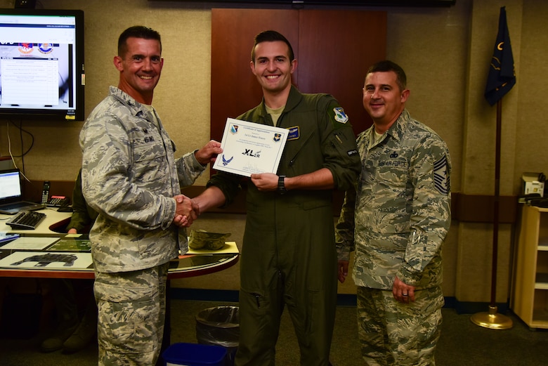 First Lt. James Tracey, 85th Flying Training Squadron instructor pilot, was chosen by wing leadership to be the “XLer” of the week, for the week of May 9, 2018, at Laughlin Air Force Base, Texas. The “XLer” award, presented by Col. Charlie Velino, 47th Flying Training Wing commander, is given to those who consistently make outstanding contributions to their unit and the Laughlin mission. (U.S. Air Force photo by Airman 1st Class Marco Gomez)