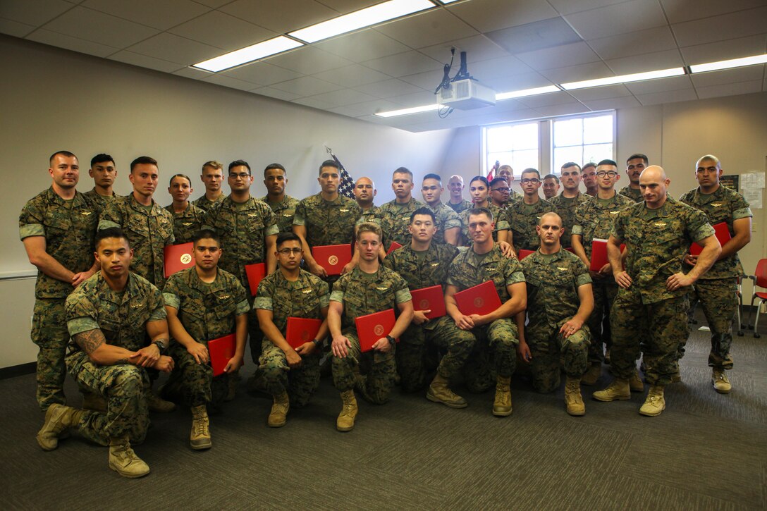 Unmanned aerial vehicle operators, with Marine Unmanned Aerial Vehicle Squadron 4, Marine Aircraft Group 41, 4th Marine Aircraft Wing, in Camp Talega on Marine Corps Base Camp Pendleton, California, were honored in VMU-4’s very first winging ceremony on June 17, 2018. This winging ceremony is historic for the Marine Corps, as it is the first time the Marine Corps has winged UAV operators. (U.S. Marine Corps photo by Cpl. Alexis B. Rocha/released)